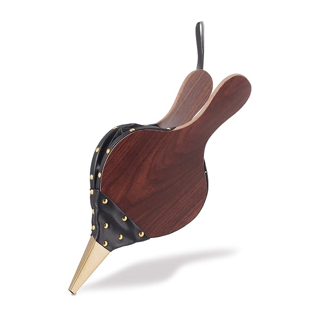 A black and brown fireplace bellows with gold-coloured decorative studs and a hanging loop