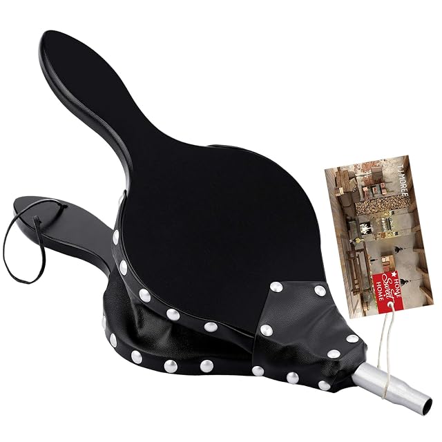 A large wooden fireplace bellows with a long handle, metal nozzle and hanging strap