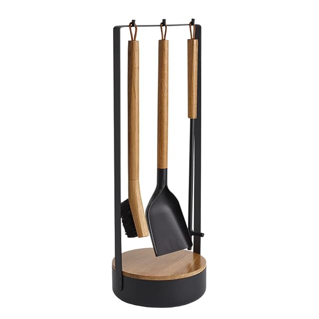A black steel and light wood four-piece fireplace set with a storage base for firelighters